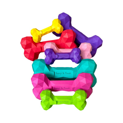 Colorful dog toys shaped like bones on a white background