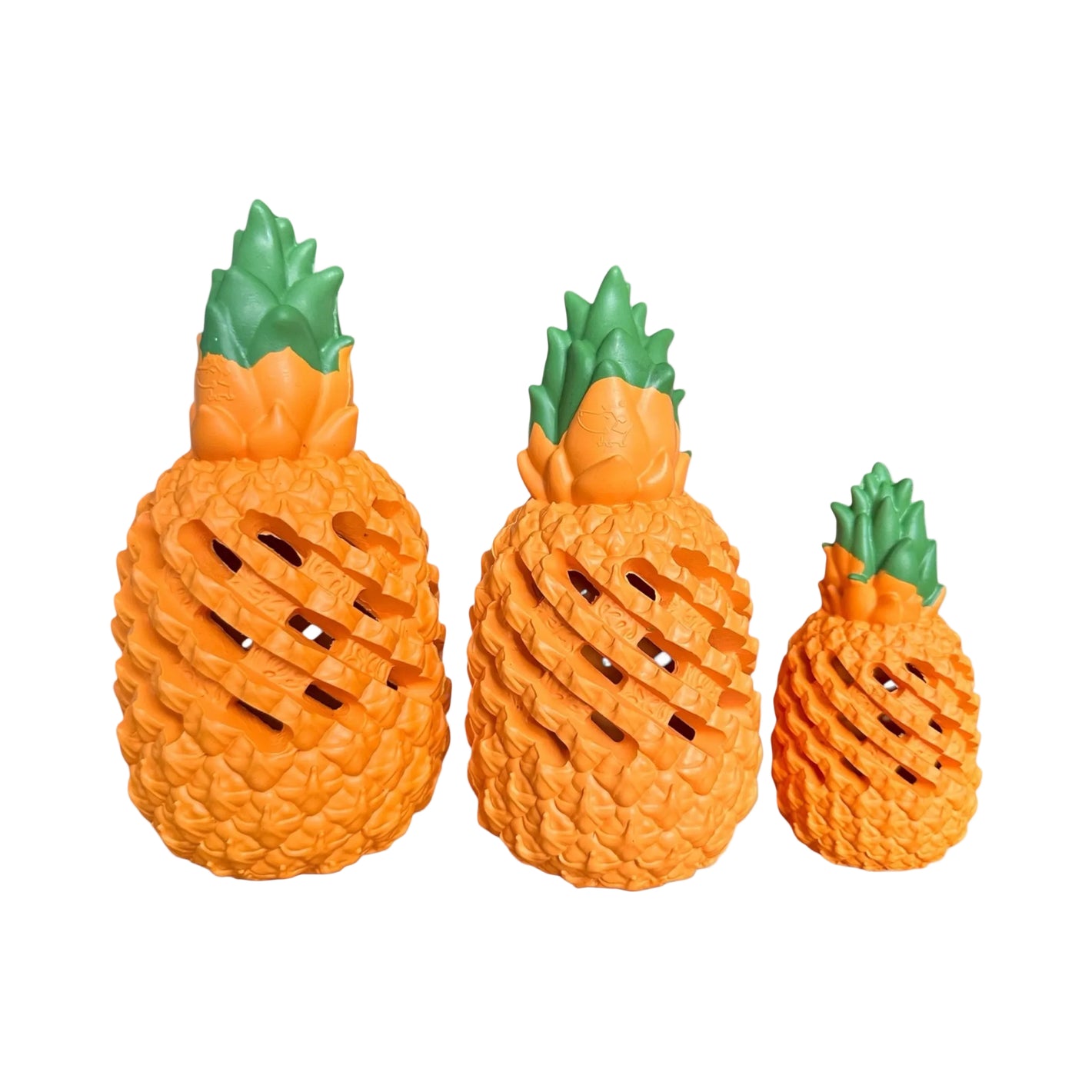 Three pineapple-shaped toys of different sizes on a white background
